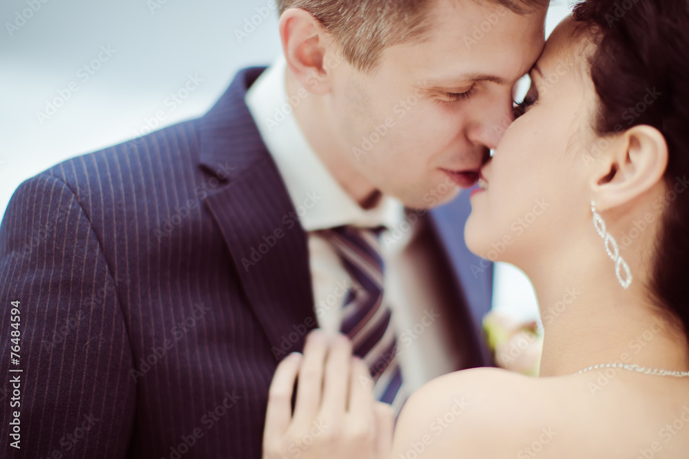 Happy bride and groom on their wedding. High key blurred image Happy bride and groom on their wedding. High key blurred image