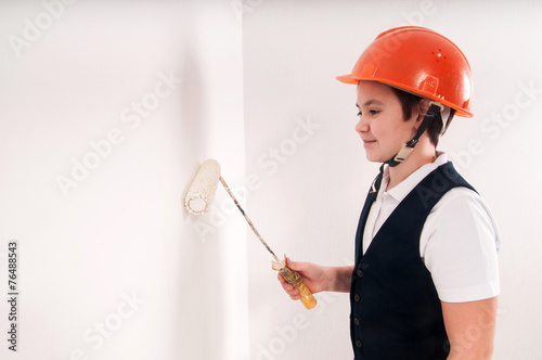 boy paints the wall