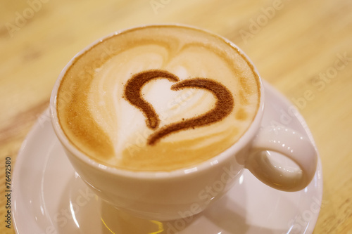 Coffee cup with milk and heart shape © Maygutyak