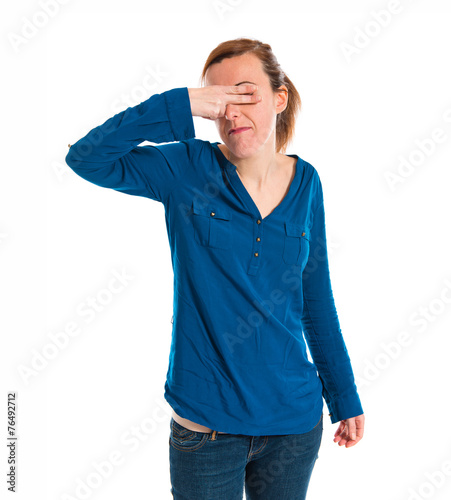 Woman covering her eyes