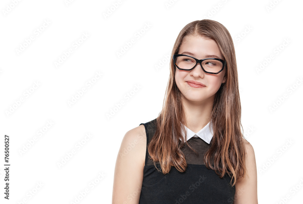 Young fashion teenage girl in glasses looking on something