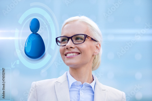 young smiling businesswoman in eyeglasses outdoors