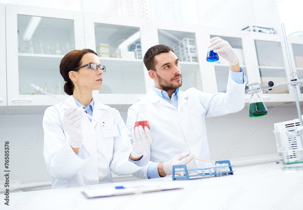 young scientists making test or research in lab young scientists making test or research in lab