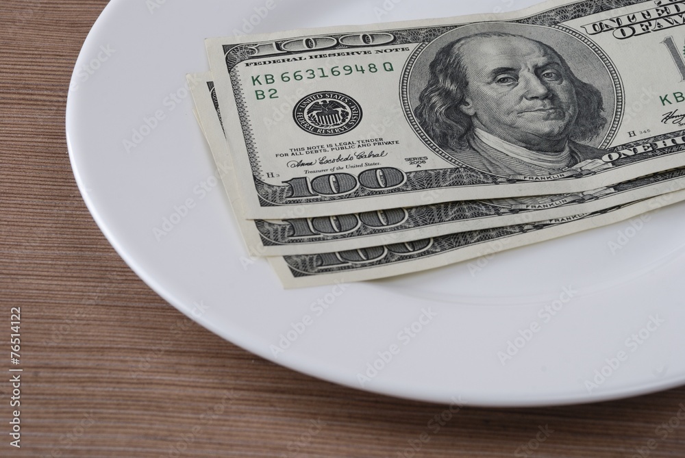 Dollar bank note money in the white plate