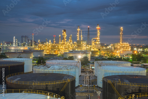 Oil refinery and storage tanks at twilight