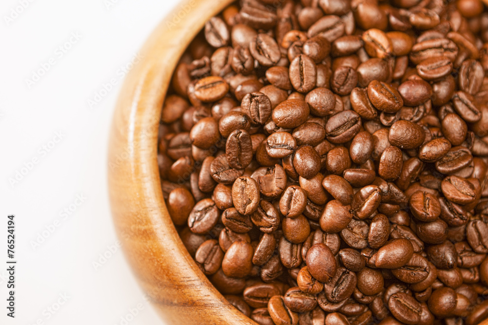 Fototapeta premium Fragment Shot of wooden Brown Bowl With Roatsed Aromatic Coffee