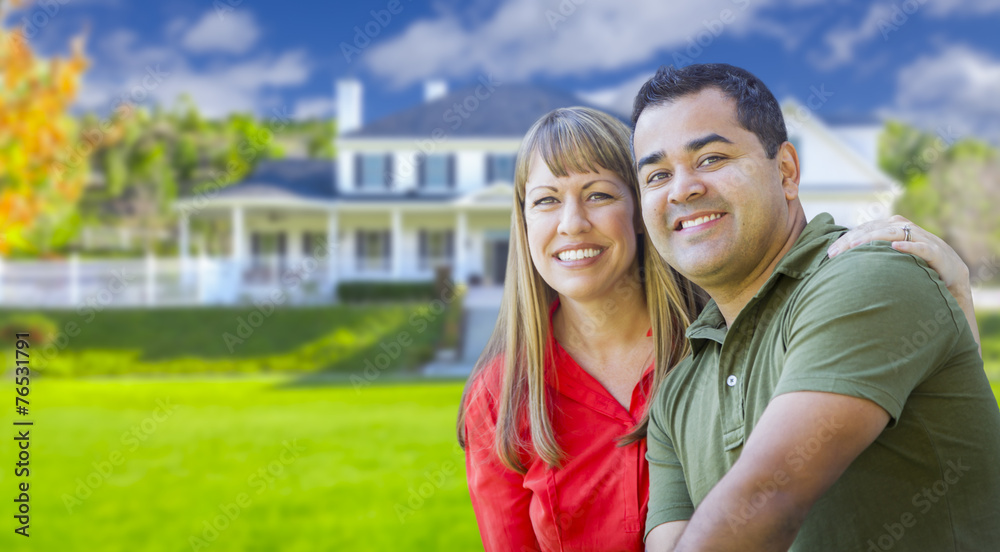 Happy Mixed Race Couple in Front of House