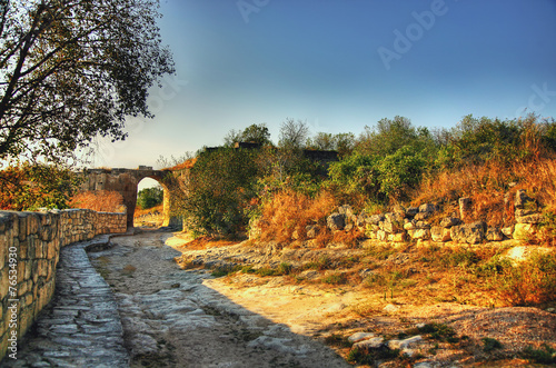 The old road. Ancient ruins. Arch. landscape background