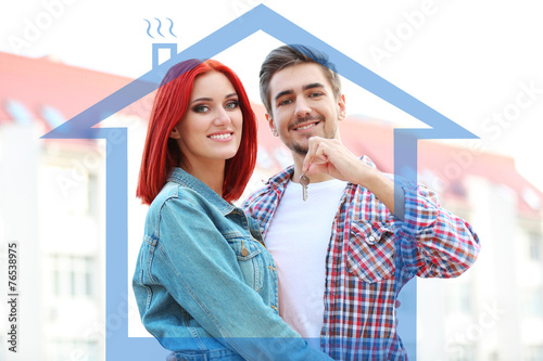 Loving couple in drawing house