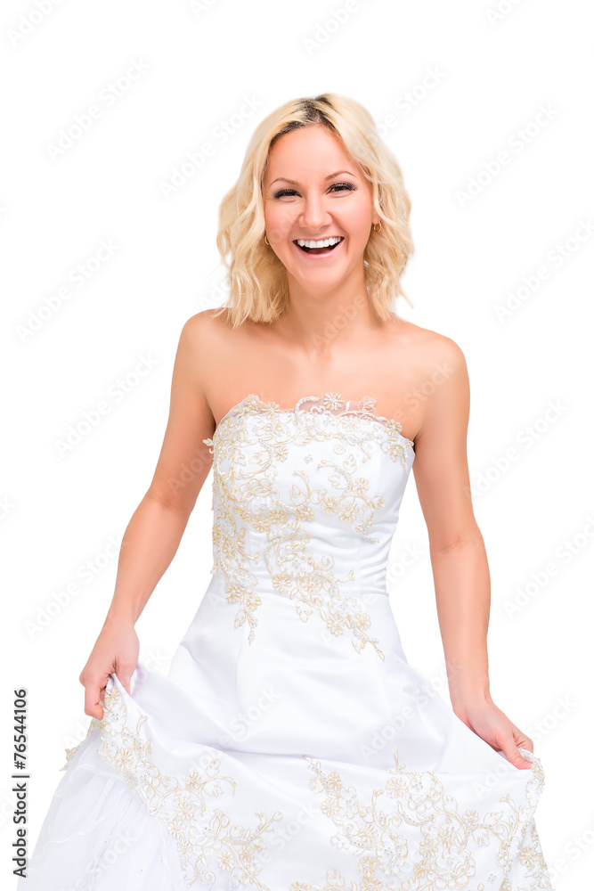laughing woman in a wedding dress posing