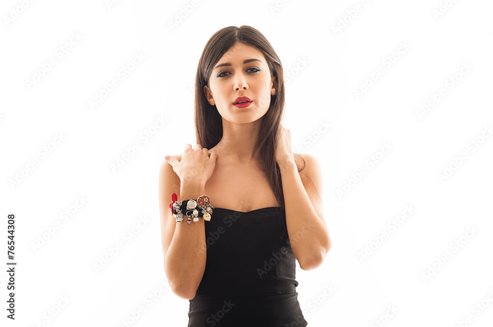 Woman wearing jewellery beauty portrait against white wall backg Woman wearing jewellery beauty portrait against white wall backg