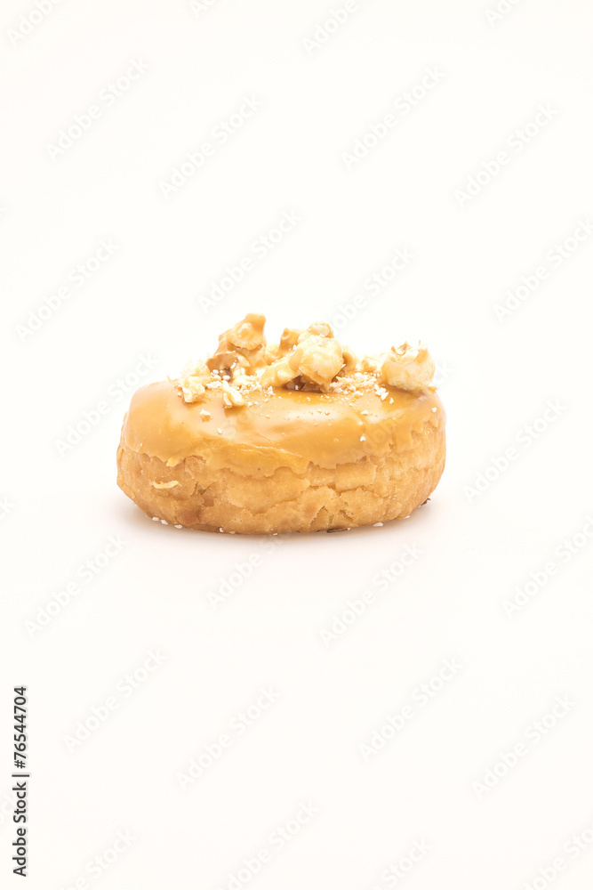 Fresh baked single donut on a white background.
