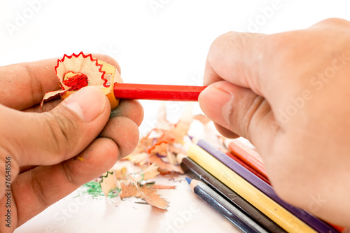 colorful pencils and pencil Sharpener on white background photo