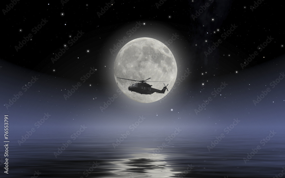 Army helicopter scouting on sea during full moon night