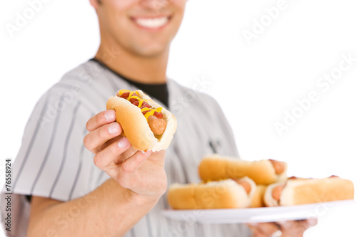 Baseball  Player Holding Plate of Hot Dogs