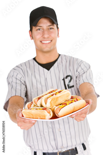 Baseball  Player Holding Plate of Hot Dogs