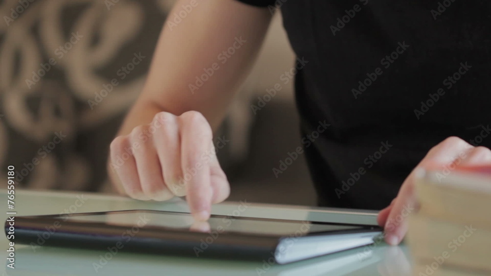 Male college student using tablet computer Male college student using tablet computer