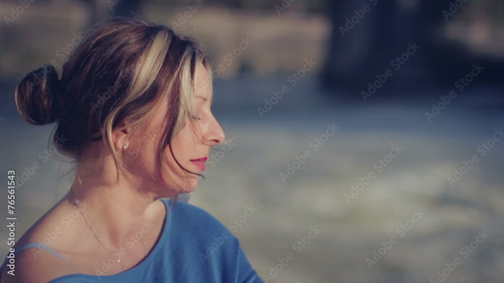 beautiful woman relaxes and sunbathe on the banks of the river Tiber in Rome beautiful woman relaxes and sunbathe on the banks of the river Tiber in Rome