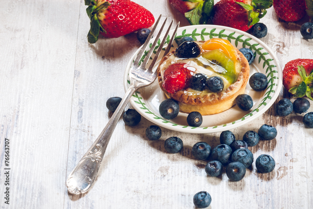 Delicious cookie made shortcrust pastry with fresh fruit, strawb Delicious cookie made shortcrust pastry with fresh fruit, strawb