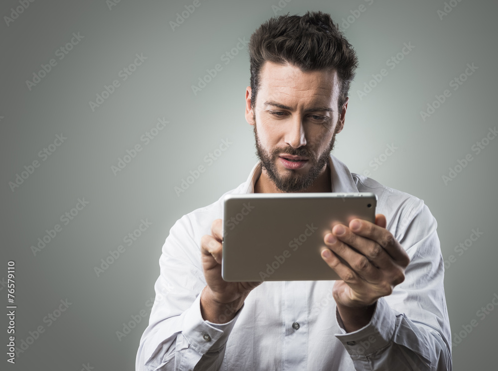 Attractive man using tablet Attractive man using tablet