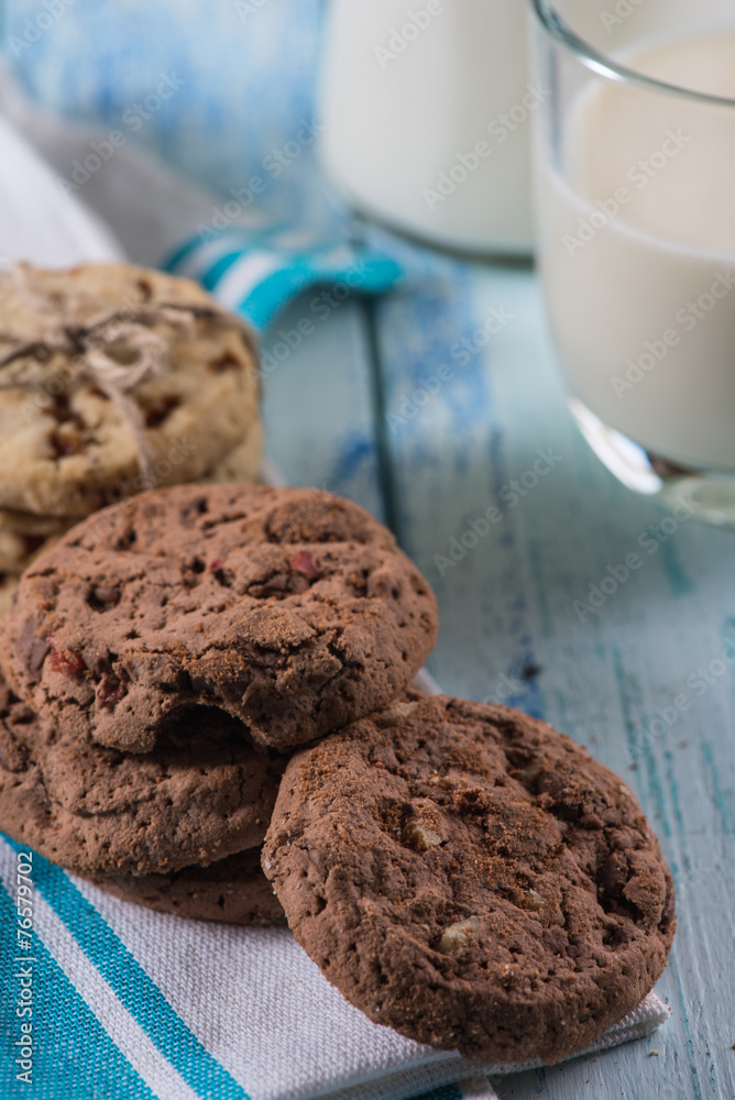 brown and white cookies with glass of fresh milk brown and white cookies with glass of fresh milk