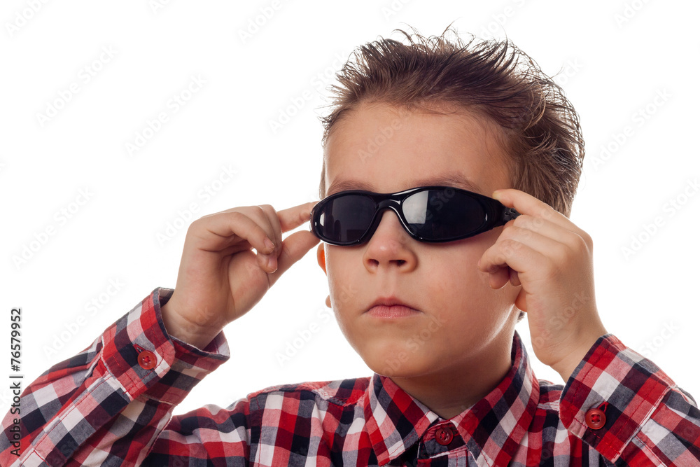 boy arranging sunglasses boy arranging sunglasses
