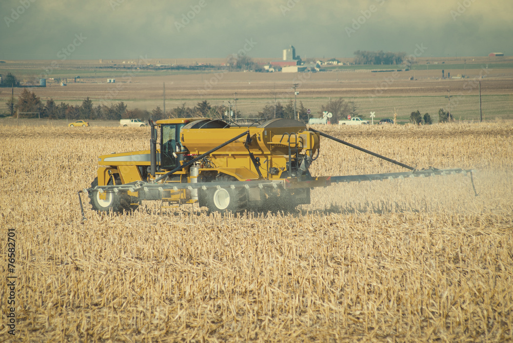 Fototapeta premium Farmer Spraying Fertilizer