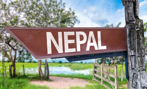 Nepal wooden sign with rural background