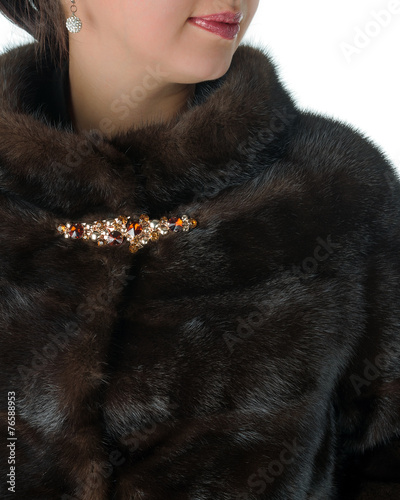 Fragment of female mink fur coat