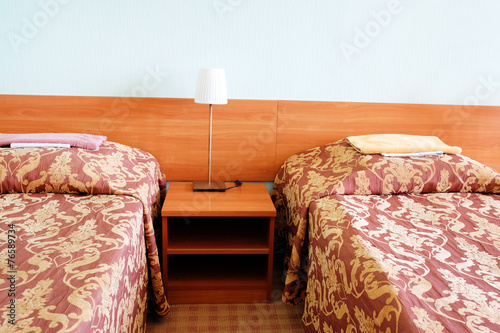 bed in motel room photo