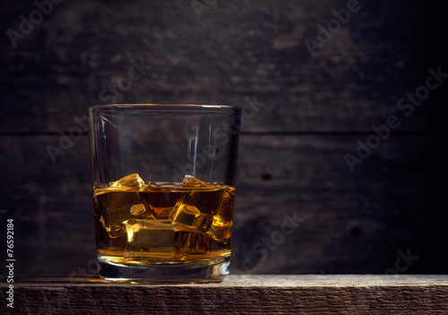 Tableau sur toile Whiskey Bourbon in a Glass with Ice