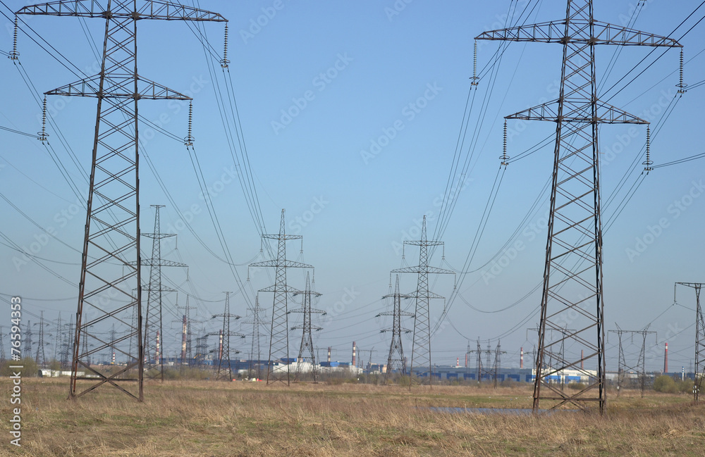 Spring landscape with electricity pylons.
