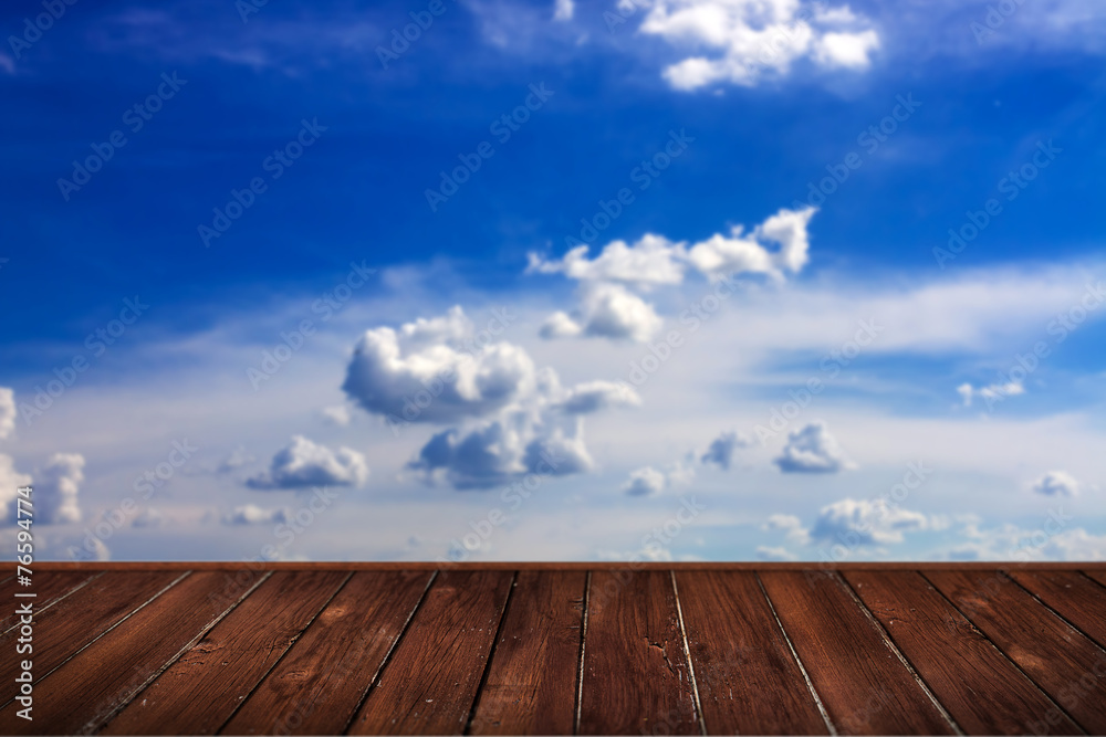 blue sky with clouds and brown wood planks floor background