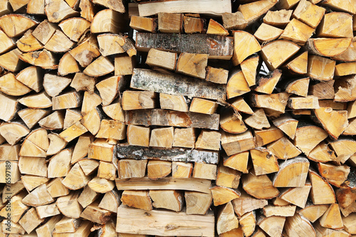 firewood stacked for storage  background