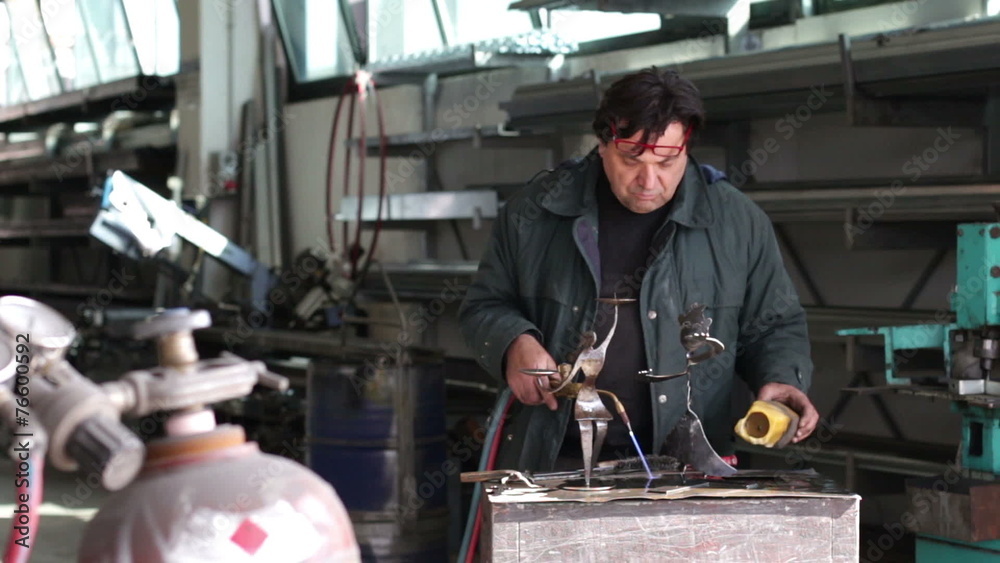 man working with the blowtorch - dolly man working with the blowtorch - dolly
