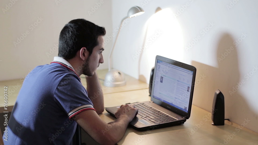 man working at the laptop  and surfing in internet