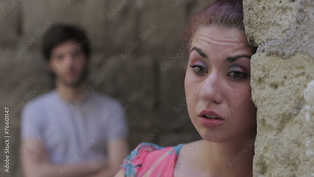 Relationship difficulties, couple fighting outdoors,the woman is crying Relationship difficulties, couple fighting outdoors,the woman is crying
