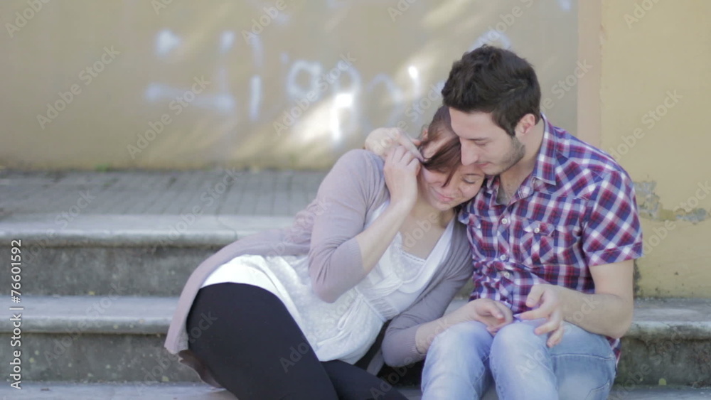 a man gives a bracelet to his girlfriend and she kisses him