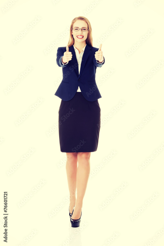 Beautiful business woman with her thumbs up. Beautiful business woman with her thumbs up.