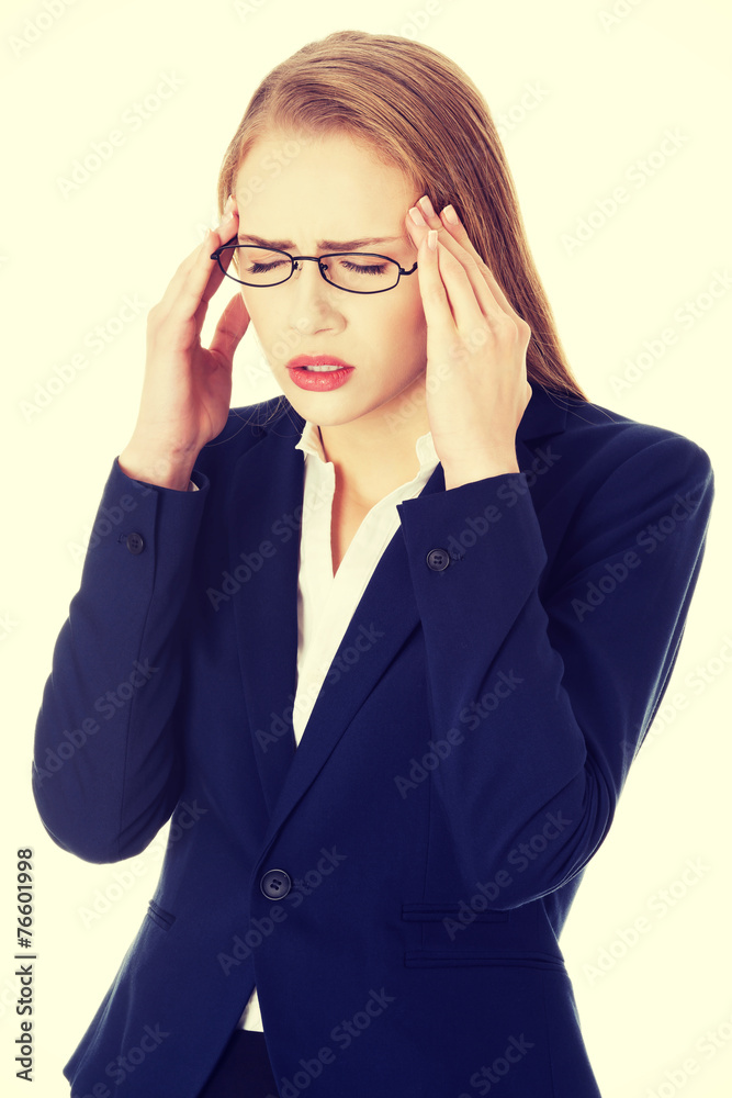 Business woman is having a headache.