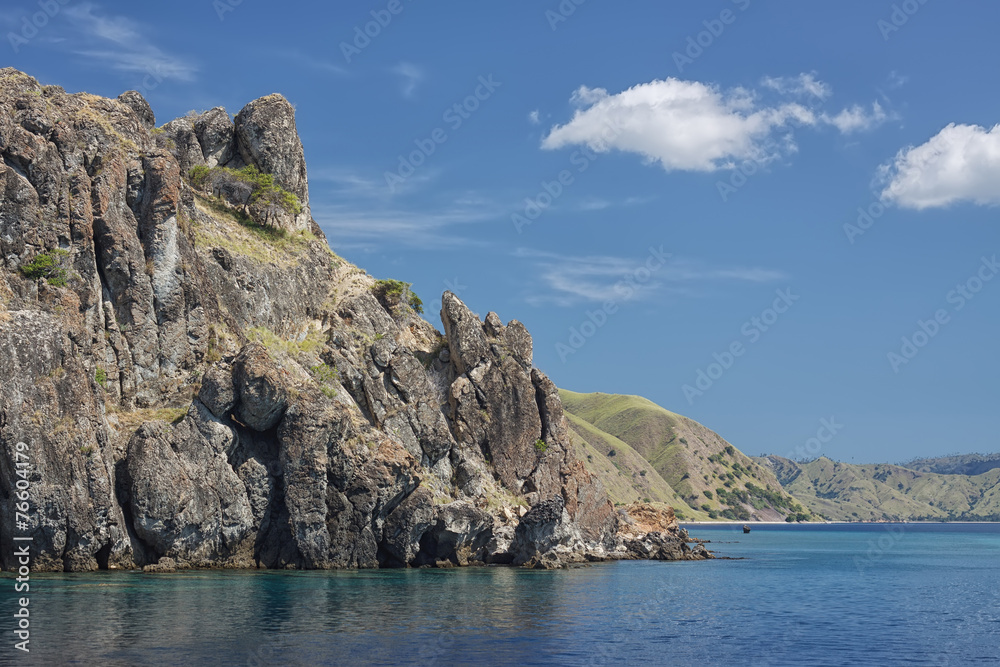 Scenic rock at the sea coast - view from water