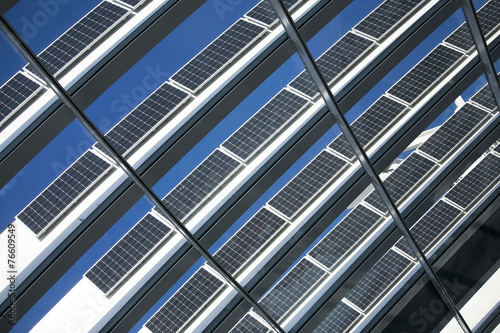 Solar Panels Against The Deep Blue Sky