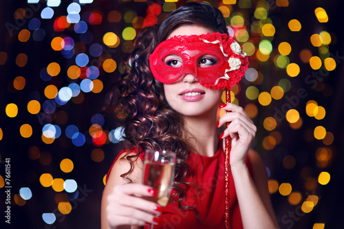 Beautiful girl with masquer...
