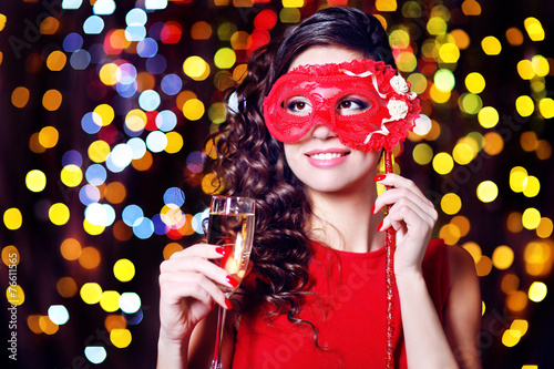 Beautiful girl with masquer...
