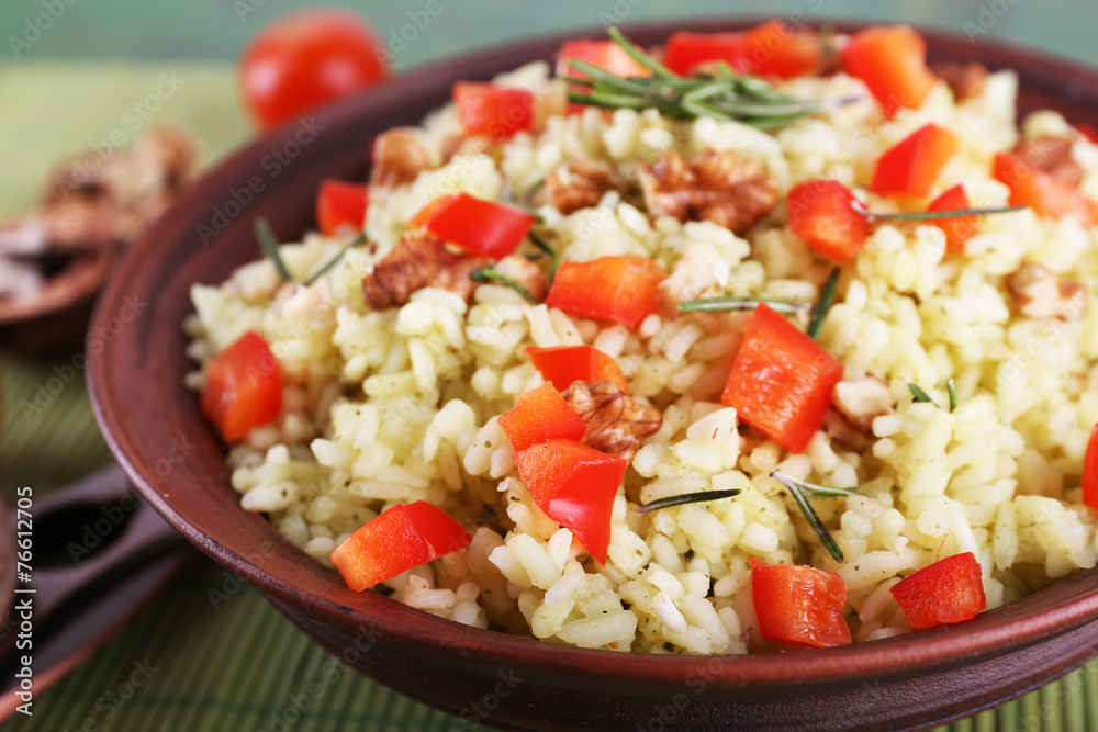 Rice with walnuts and cherry tomatoes in plate Rice with walnuts and cherry tomatoes in plate