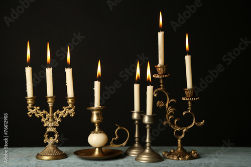 Retro candlesticks with candles photo