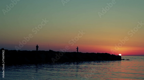 Wallpaper Mural fishermen fishing on the rocks at sunset -fischerman - sea Torontodigital.ca
