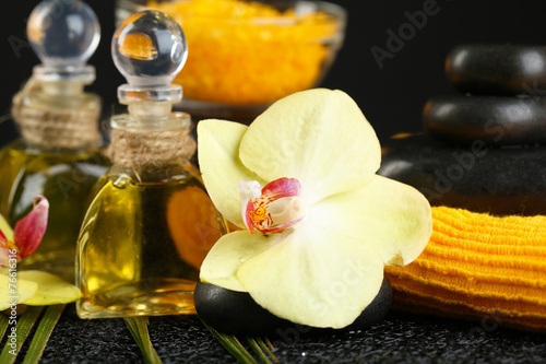 Beautiful spa composition with orchid on dark background