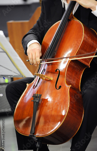 Close up of a cellist playing a cello