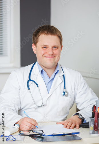 Portrait of confident doctor with stethoscope looking at the cam